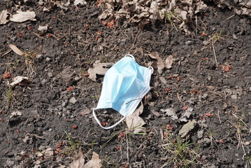 Dead leaves and dust on the floor. The waste mask alone, the result of covid19.