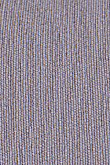 Grey cloth background with smooth lines. Texture of coarse fabric with a seam in a line.