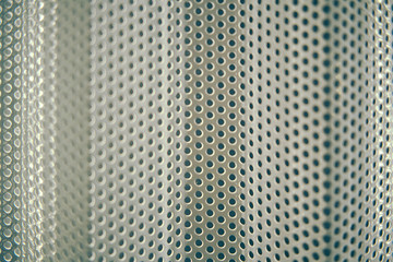 Blurred abstract background of lattice with round holes