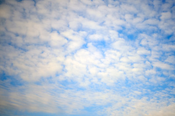 White clouds in the blue sky, copy space for inscription