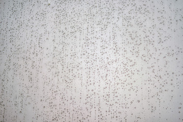 Background with water drops on the glass surface of the window, copy space for text