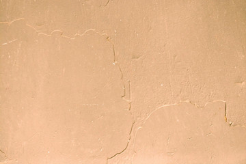 Background of dried paint in on the metal yellow texture with rust