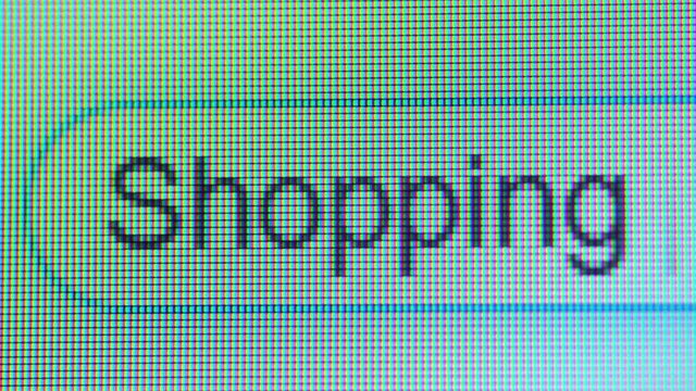 Computer monitor displaying browser tab with typed shopping word. Shot in 4k resolution