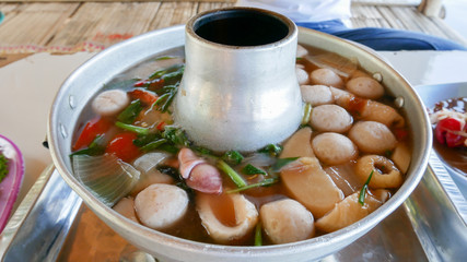 Thai tom yum soup, Thailand food soup with Shrimp and squid with curry coconut milk.Asian food delicious cooking