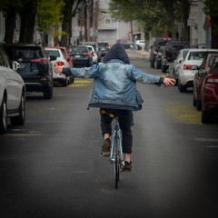 Fototapeta na wymiar Man with open hands on a bike