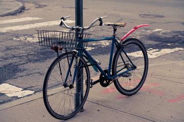 Fototapeta na wymiar Bike locked to sign post