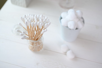 White cotton swabs cotton bud and cotton ball on background