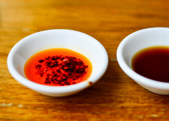 Chinese Red Chili Oil with Vinegar Beside