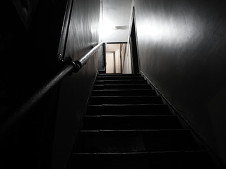 Fototapeta na wymiar Stairwell to old apartment black and white