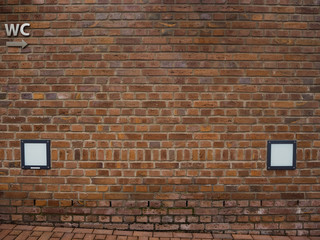 Fototapeta na wymiar brick wall with a sign