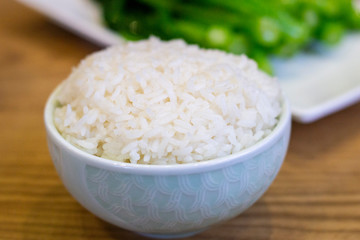 Chinese steamed plain rice in white bowl