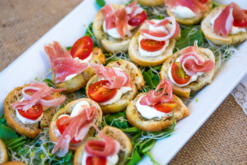 Ham and tomato bruschettas