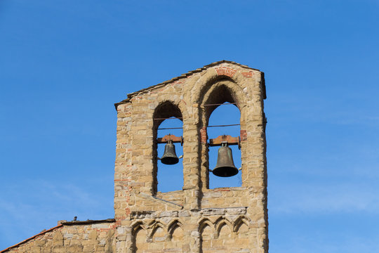 Bell tower of the Basilica of San Domenico in a sunny day, Arezzo, Tuscany, Italy.
