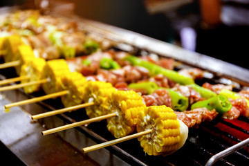 Barbecue skewers meat kebabs with corn and vegetables
