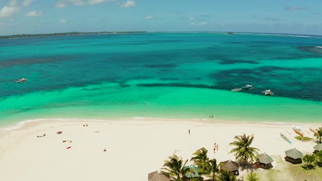 Travel concept: sandy beach on a tropical island by coral reef atoll from above. Daco island, Philippines. Summer and travel vacation concept