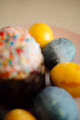 colored eggs and Easter cake on a plate