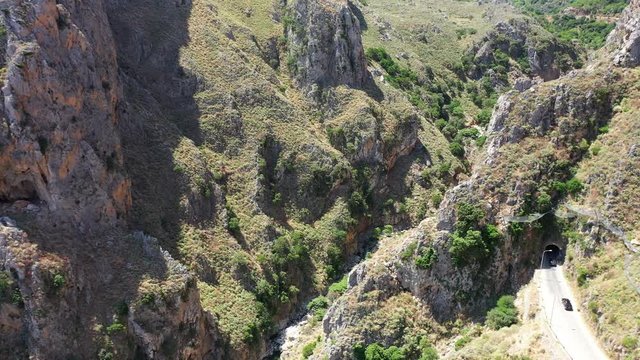 Aerial video on Topolia Gorge canyon and road tunnel. Crete, Greece.