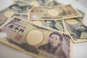 Japanese yen bank note on white background.