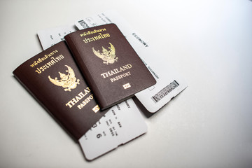 Thai passport with Plane ticket background.  