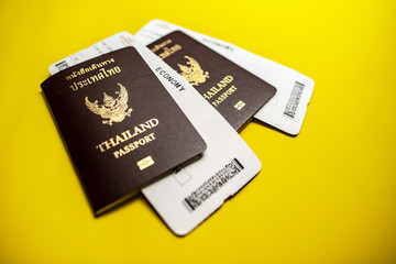 Thai passport with Plane ticket background.  