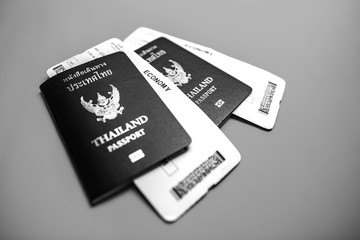 Thai passport with Plane ticket background.  