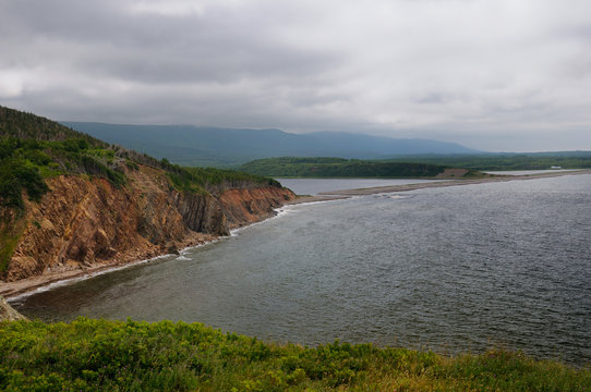 Red cliffs and sandbar at Grande Falaise on the Cabot Trail Cape Breton Highlands National Park