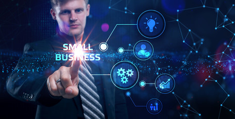 Business, Technology, Internet and network concept. Young businessman working on a virtual screen of the future and sees the inscription: small business