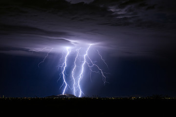Naklejka na ściany i meble Bright lightning from a storm in Arizona