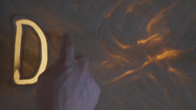 DON'T Inscription. Sand On The Illuminated Glass.
