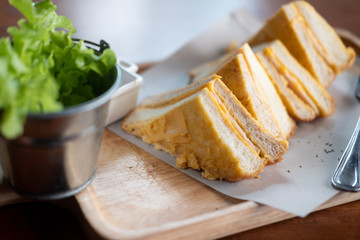 Classic cheese and ham toasted sandwich cut in half