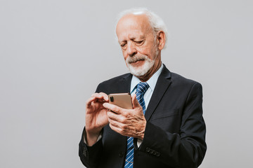 Senior businessman using a smartphone