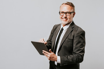 Business man writing on an agenda