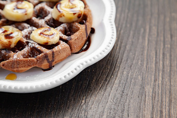 Chocolate banana waffle with caramel sauce