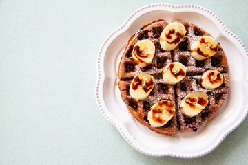 Chocolate banana waffle with caramel sauce