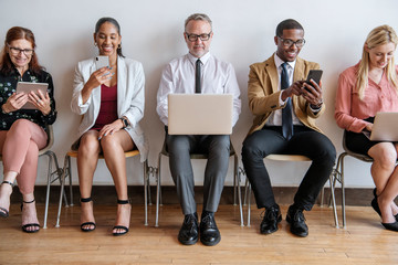 Diverse business team with different devices