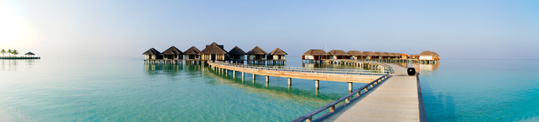 Panoramic view on water villas at tropical resort