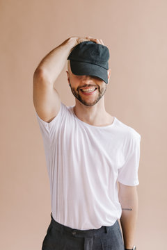 Man Wearing A Black Cap