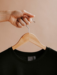 Black sweater on a hanger