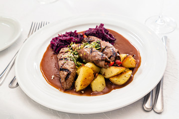 grilled pork  with potatoes and salad