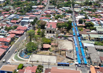 Aerial of San Rafael de Escazu, Costa Rica with the traditional Church and farmers market.