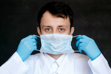 Coronavirus surgical mask doctor wearing face protective mask against corona virus banner panoramic medical professional preventive gear