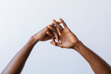 Man clasping his hands