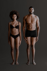 Seminude black couple