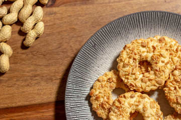 sable biscuits with chopped peanuts on top