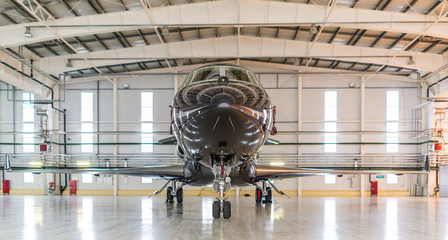 Private jet plane in hangar