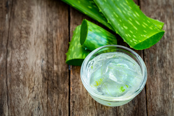 Jelly aloe vera in bowl on wooden tablebackground.