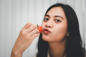 Woman eat strawberry red berry fruit sweet juicy