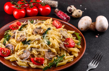 Pasta with mushrooms, cheese, spinach, rukkola and cherry tomatoes