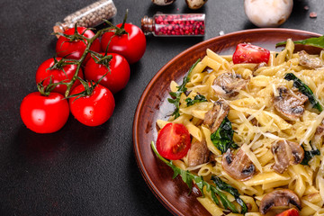 Pasta with mushrooms, cheese, spinach, rukkola and cherry tomatoes