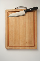 chopping board with kitchen knife